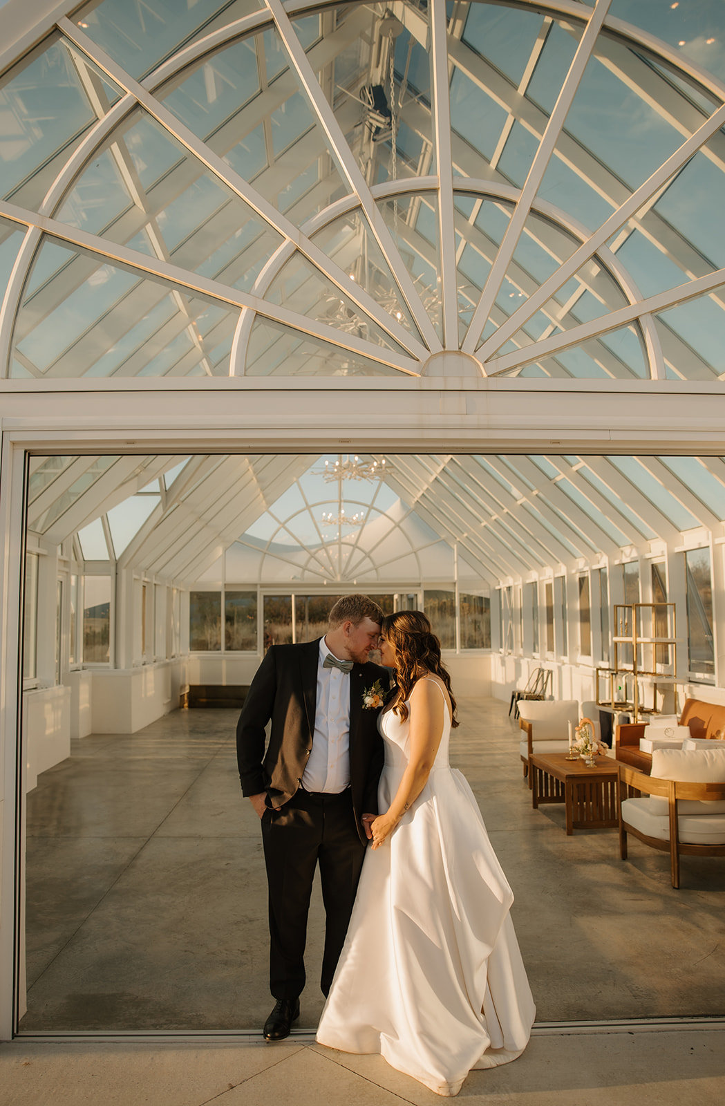 bride-and-groom-in-front-of-greenhouse