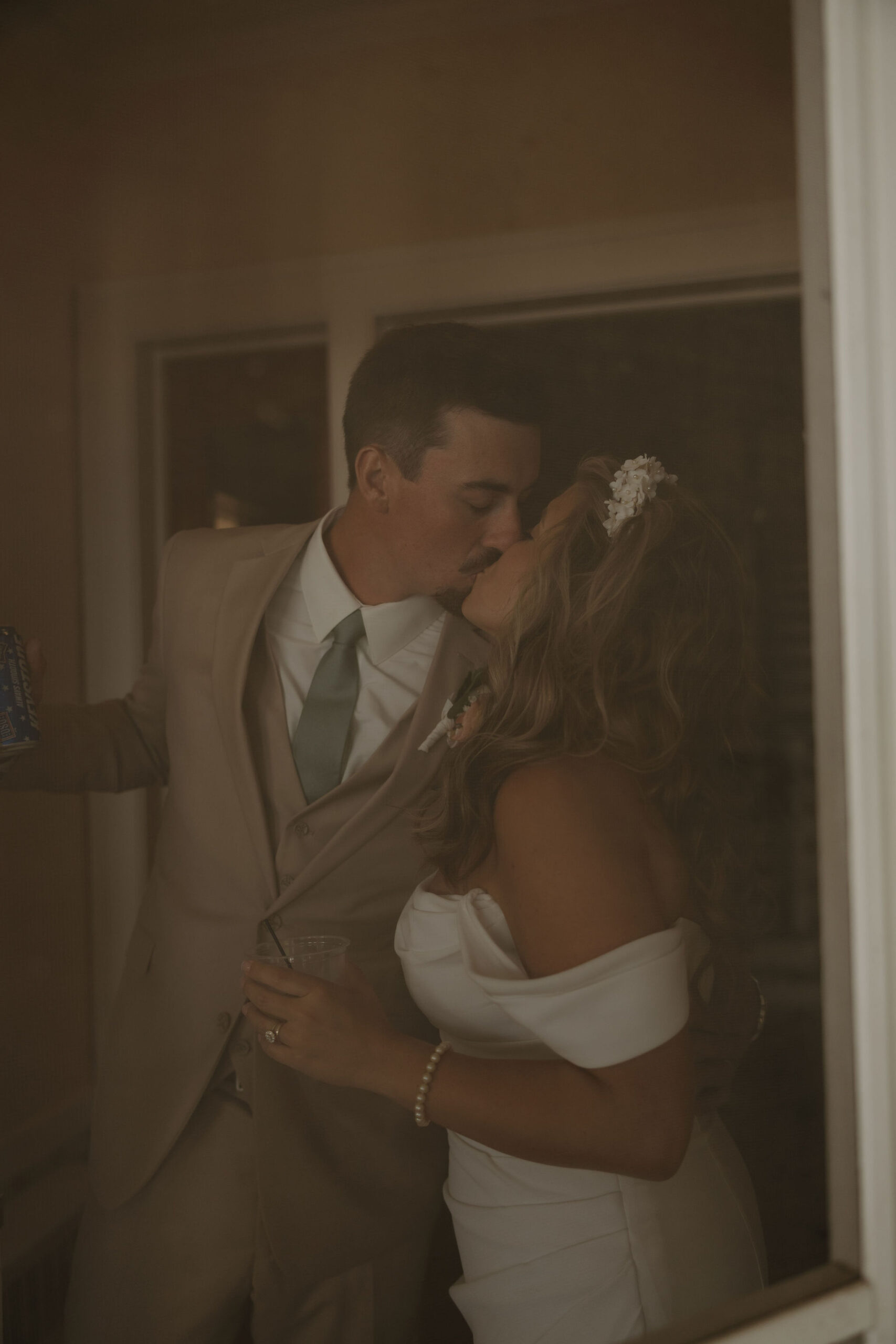 bride-and-groom-photo-taken-through-screen